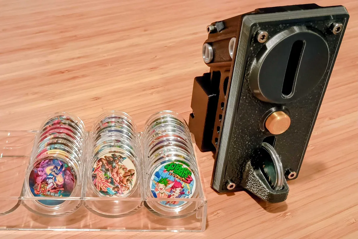 Arcade reader with a custom NFC coin collection by Foolz