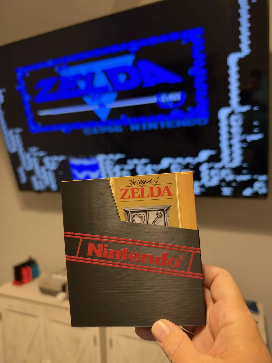 Gold 3D-printed Zelda cartridge with an NFC tag inside, in a printed Nintendo sleeve